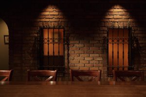 大阪・天満のBAR ALBAの店内。レンガ壁と温かみのある照明が特徴的な雰囲気のあるバー Rustic brick wall interior of BAR ALBA, a whisky and cocktail bar in Osaka Tenma.